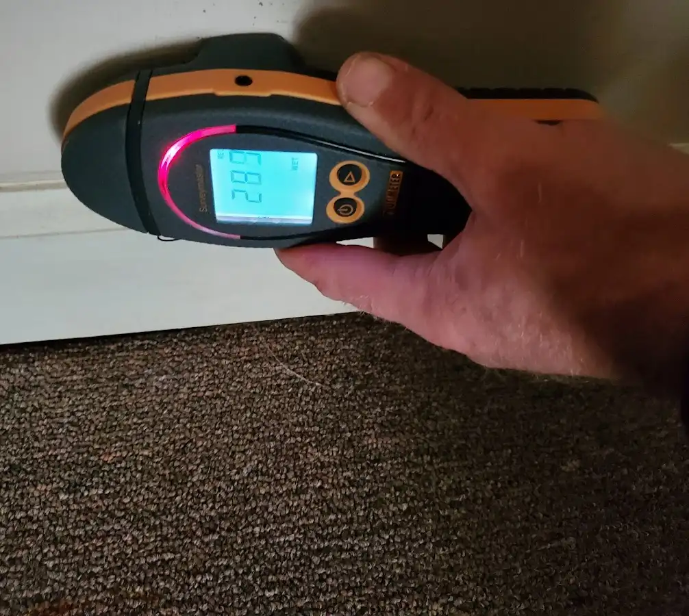Moisture detection at baseboard during Burst Pipe Cleanup in South River